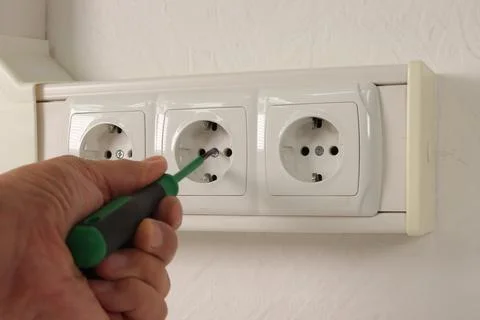 Installing an electrical connector. Stock Photos