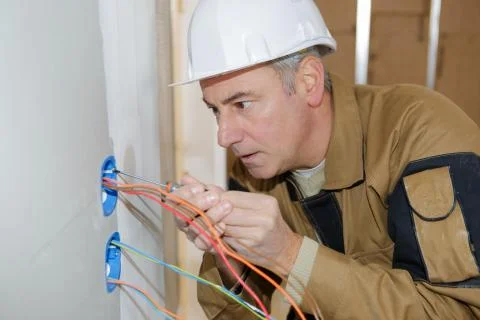 Installing electrical lines Stock Photos