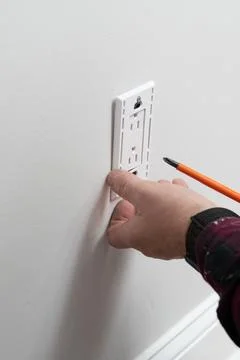 Installing an electrical outlet Stock Photos