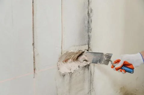 Installing electrical socket box. Stock Photos