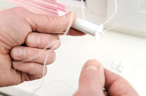 Installing fabric roller blinds. Stock Photos
