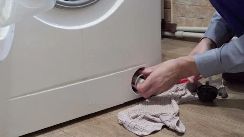 Installing a filter in the washing machine Video stock 280404924