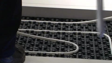 Installing floor heating worker Stock Footage 59847486