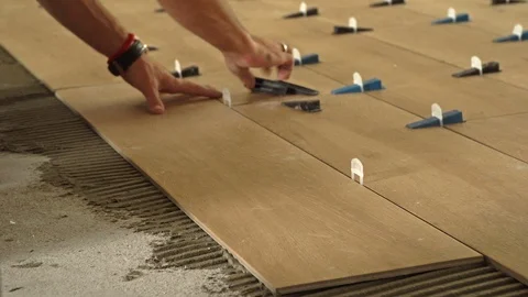 Installing floor tiles Stock Footage 102989174