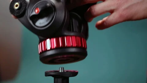 Installing fluid head to tripod. Stock Footage 127525354