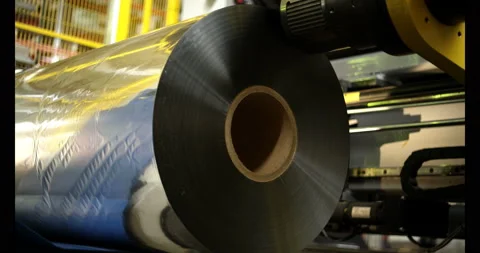 Installing the foil roll in its place in the machine Stock-Footage 89908871