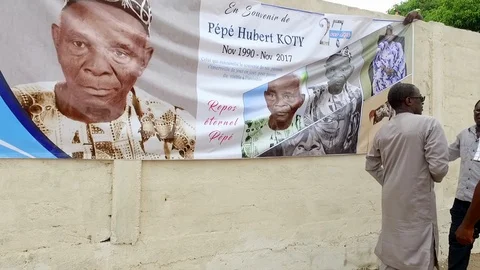 Installing a funeral banner Stock Footage 87029257