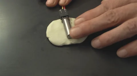 Installing the fuse on a plastic bomb. Stock Footage 43089339