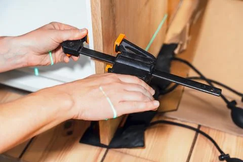 Installing Hardware Using Tool On Wooden Surface Stock Photos