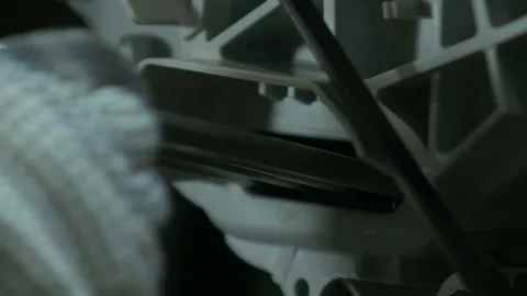 Installing of heating element into washing machine Stock Footage 90022527