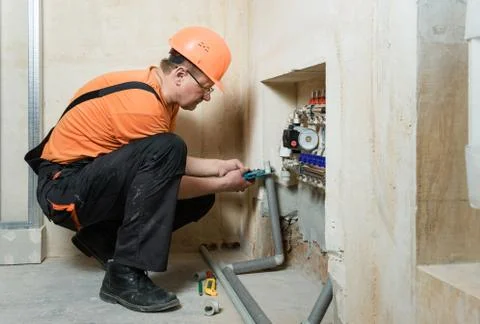 Installing the home heating system. Stock Photos