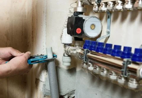 Installing the home heating system. Stock Photos
