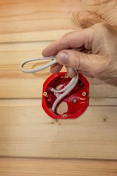 Installing an indoor socket in a wall sheathed with a wooden lath Stock Photos