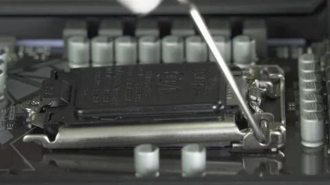 Installing Intel Central processor CPU to socket 1200 on Motherboard. Stock Footage 203808523