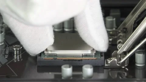 Installing Intel Central processor i9 CPU to socket 1200 Motherboard. Editorial Stock Footage 147364135