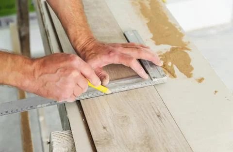 Installing laminate flooring. Stock Photos