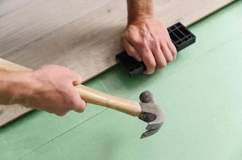 Installing laminate flooring. Stock Photos