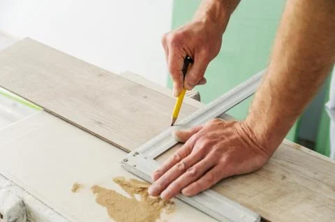 Installing laminate flooring. Stock Photos