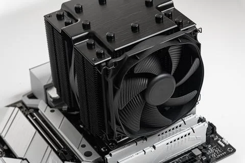 Installing a large cooler on a computer processor. 写真素材