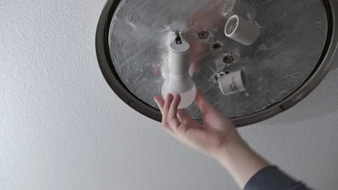 Installing a light bulb in a socket Stock-Footage 303675008
