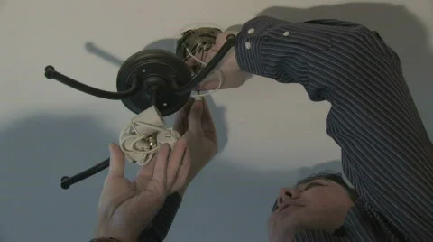 Installing Light Fixture Stock Footage 279983