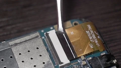 Installing the loop into the printed circuit board with tweezers Stock Footage 174913476