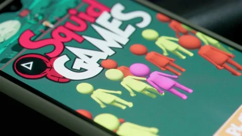 Installing mobile game of created based on new Netflix show - Squid games 動画素材 163190445