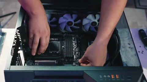 Installing motherboard into computer case Stock Footage 328985226