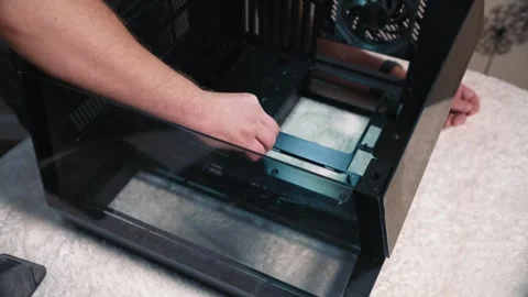 Installing motherboard standoffs inside computer case Stock Footage 332183151
