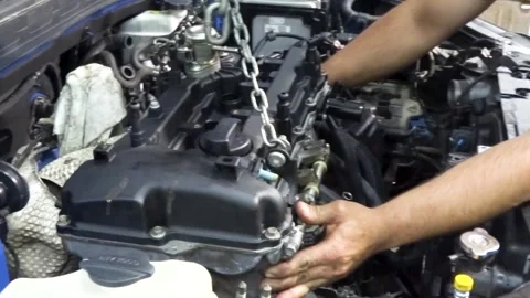 Installing the motor into engine compartment Stock Footage 169828069
