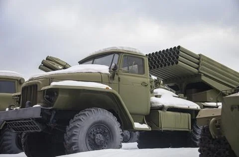 Installing multiple launch rocket system in parking lot after snowfall. Stock Photos