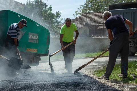 Installing new asphalt surface on a road Stock Photos