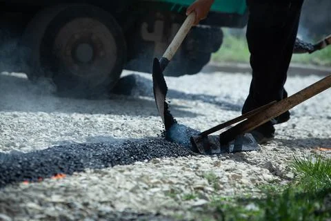 Installing new asphalt surface on a road Stock Photos