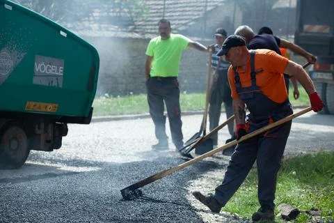 Installing new asphalt surface on a road Stock Photos