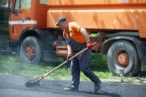 Installing new asphalt surface on a road Stock Photos
