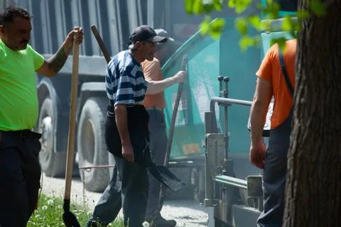 Installing new asphalt surface on a road Stock Photos
