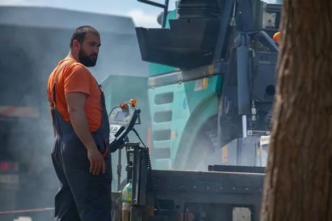 Installing new asphalt surface on a road Stock Photos