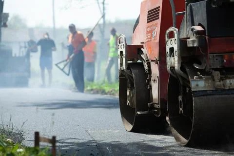 Installing new asphalt surface on a road Stock Photos