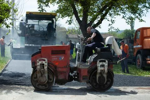 Installing new asphalt surface on a road Stock Photos