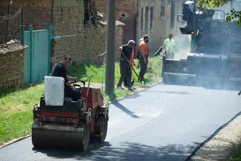Installing new asphalt surface on a road Stock Photos