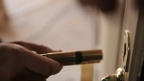 Installing new door lock Stock Footage 70913625