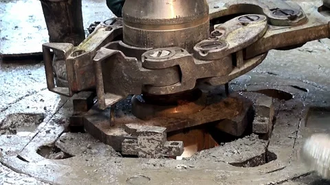 Installing a new drilling bit at the wellhead of the oil derrick. Stock Footage 256889433
