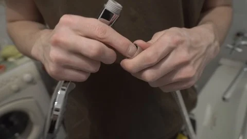 Installing a new faucet in the bathroom Stock Footage 108308324