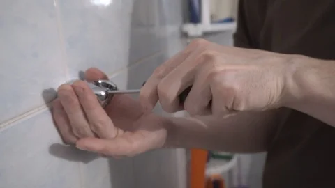 Installing a new faucet in the bathroom Stock Footage 108308524