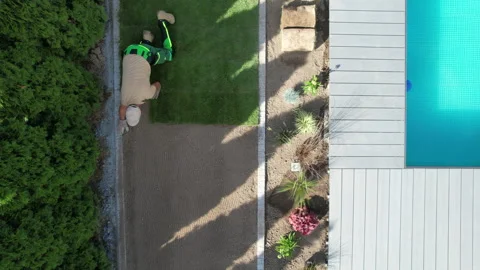 Installing New Grass Near Pool Deck Video stock 276690452