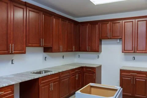 Installing new induction hob i modern kitchen Stock Photos
