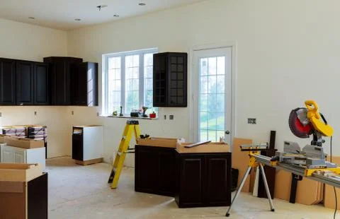 Installing new induction hob in modern kitchen Stock Photos