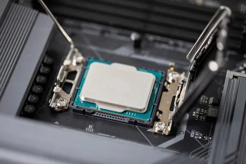 Installing a new intel processor by the computer user Stock Photos