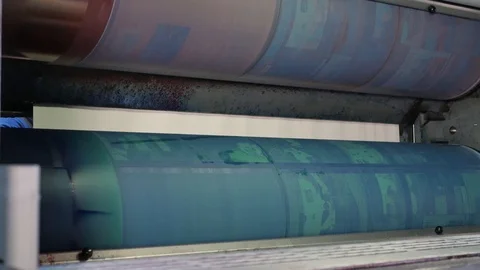 Installing new printing plates at the ink rollers of press machine Stock Footage 121809468