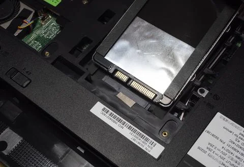 Installing new solid-state drive to laptop pc. SATA and power connection close Stock Photos